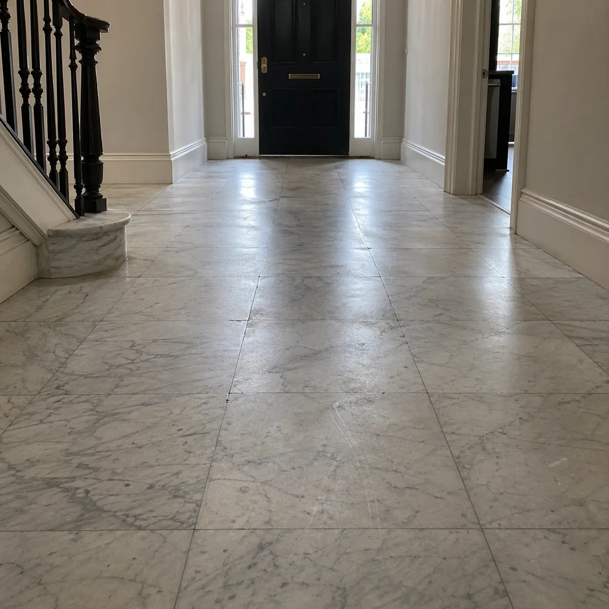 Dulled and scratched marble foyer floor before polishing
